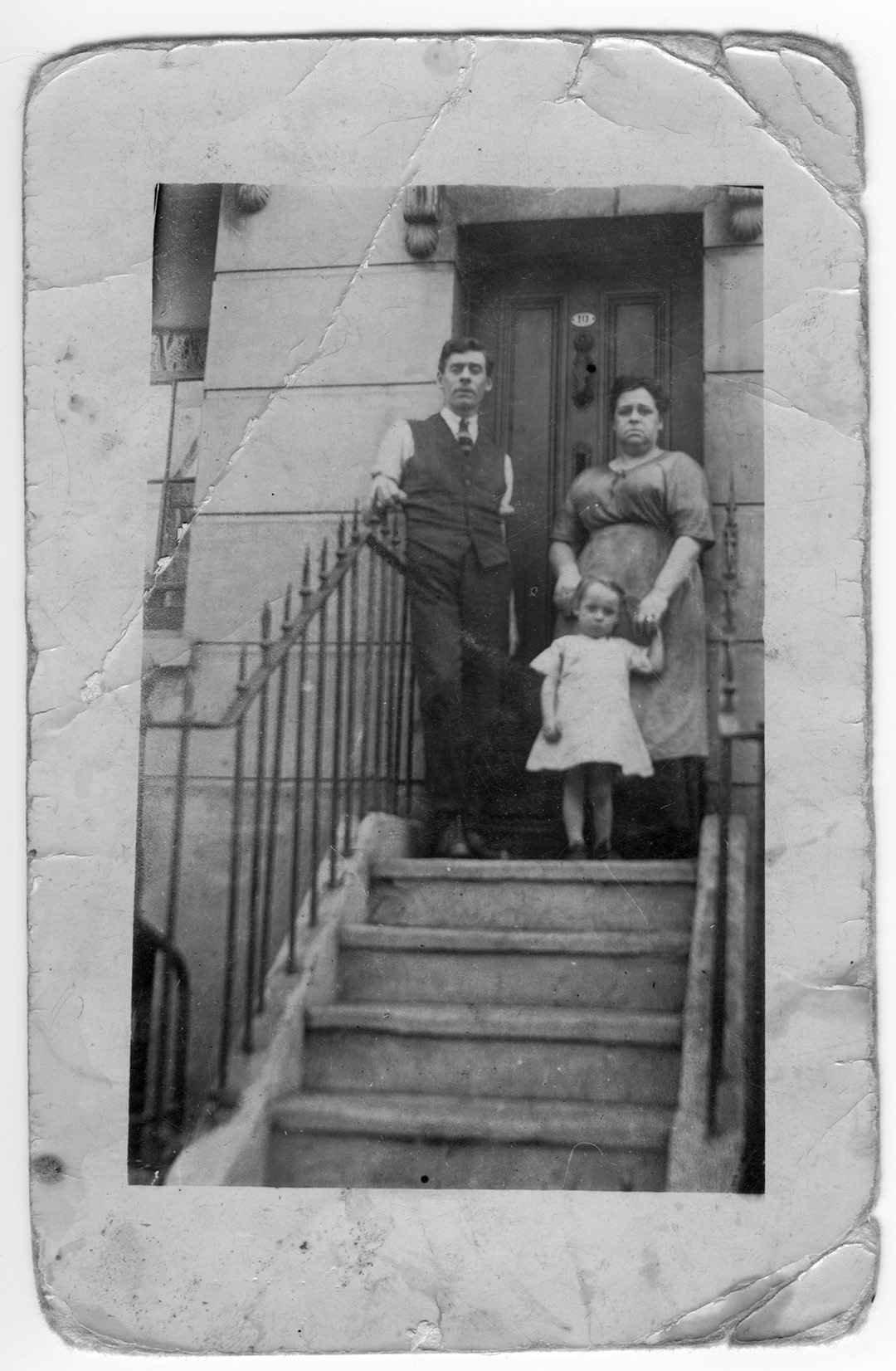 Old photograph family on house steps early 1900s